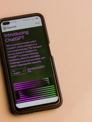 Smartphone screen showing ChatGPT introduction by OpenAI, showcasing AI technology.